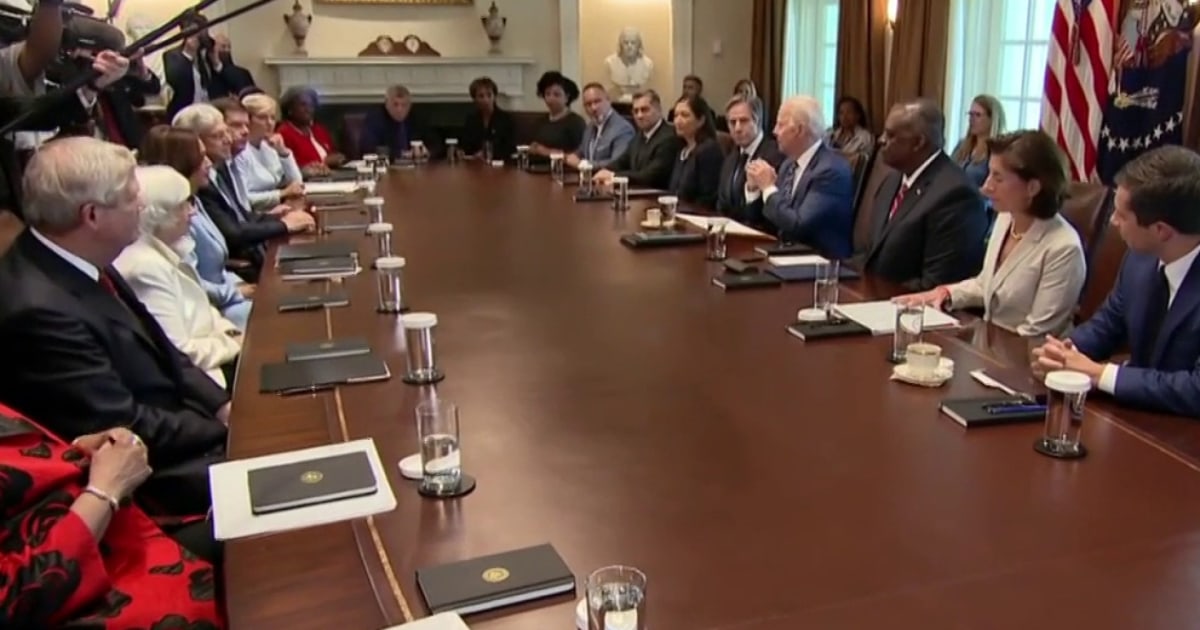 Biden holds meeting to mark six months in office