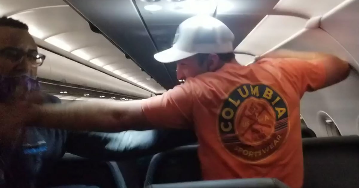 Watch Passengers ducttaped intoxicated man to seat after he groped flight attendants