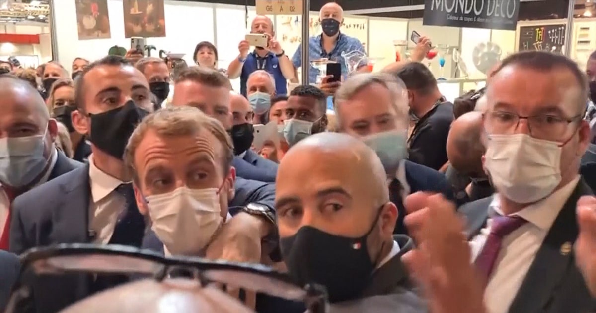 WATCH: French President Macron hit with egg, man detained at scene