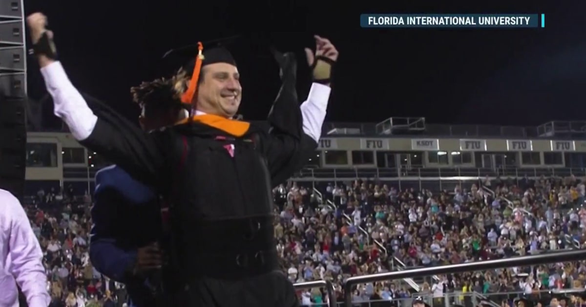 Paralyzed graduate walks to receive his Master's degree