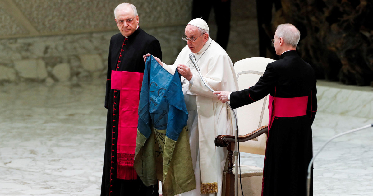 Pope Francis holds Ukrainian flag from ‘martyred’ city of Bucha