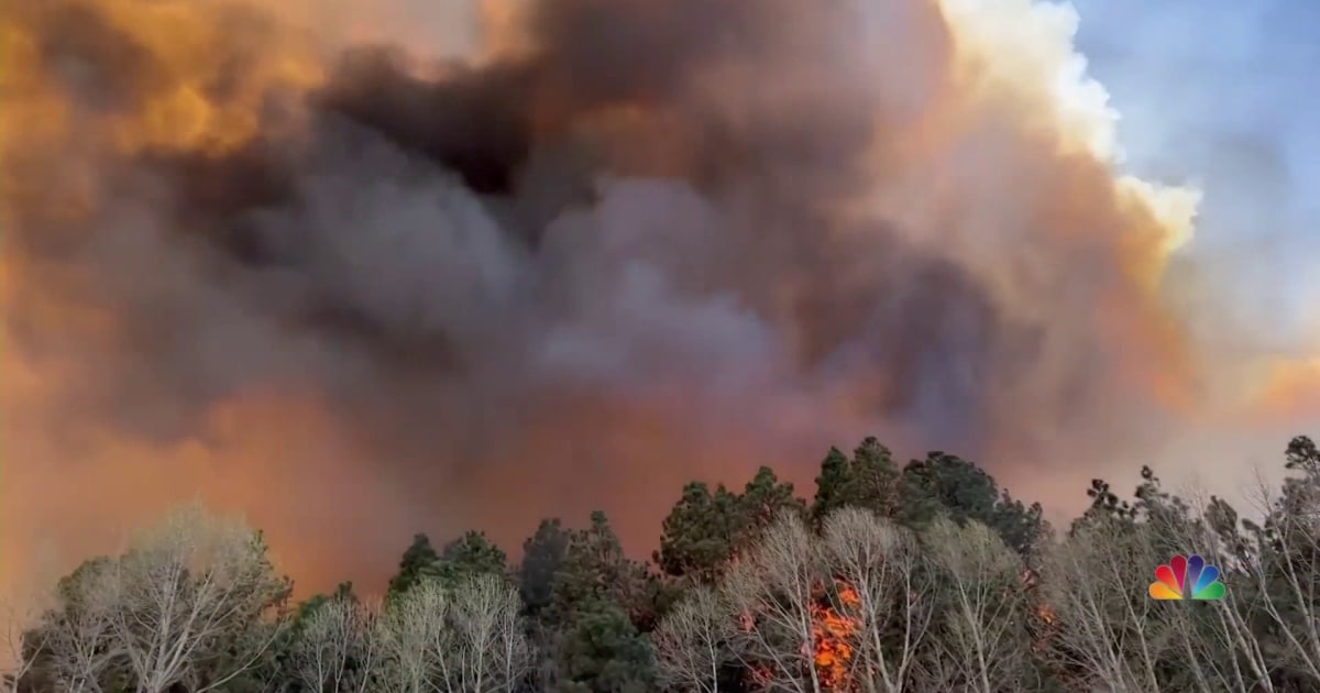 Two New Mexico fires merge into one torching 100,000 acres