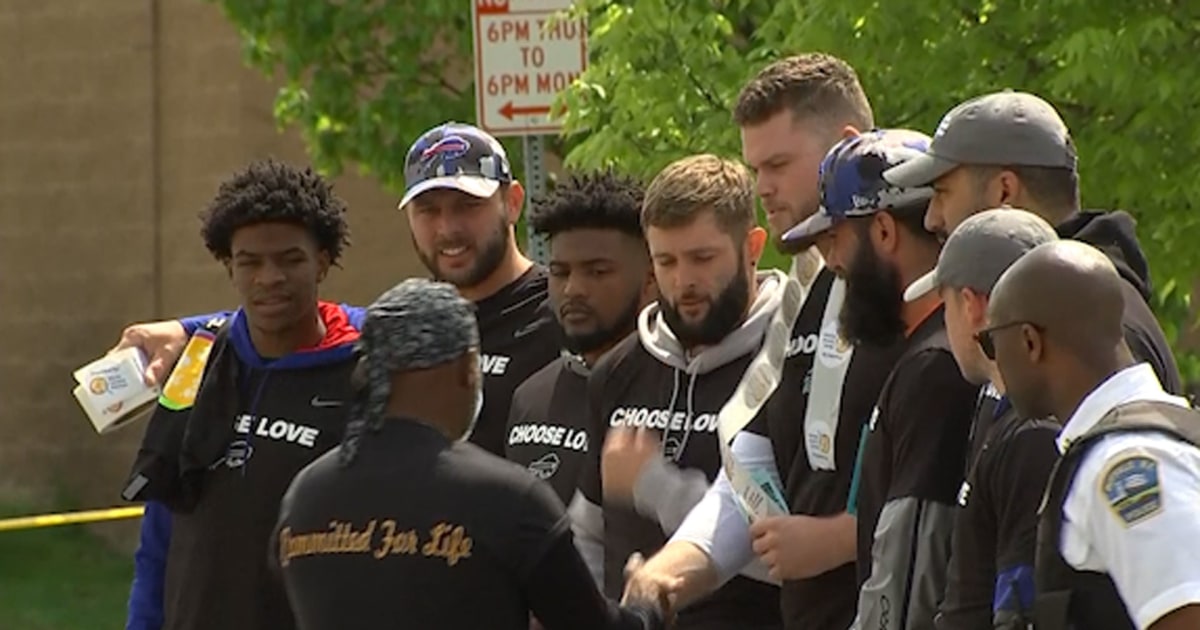 Buffalo Bills visit Tops grocery store to pay their respects to shooting victims