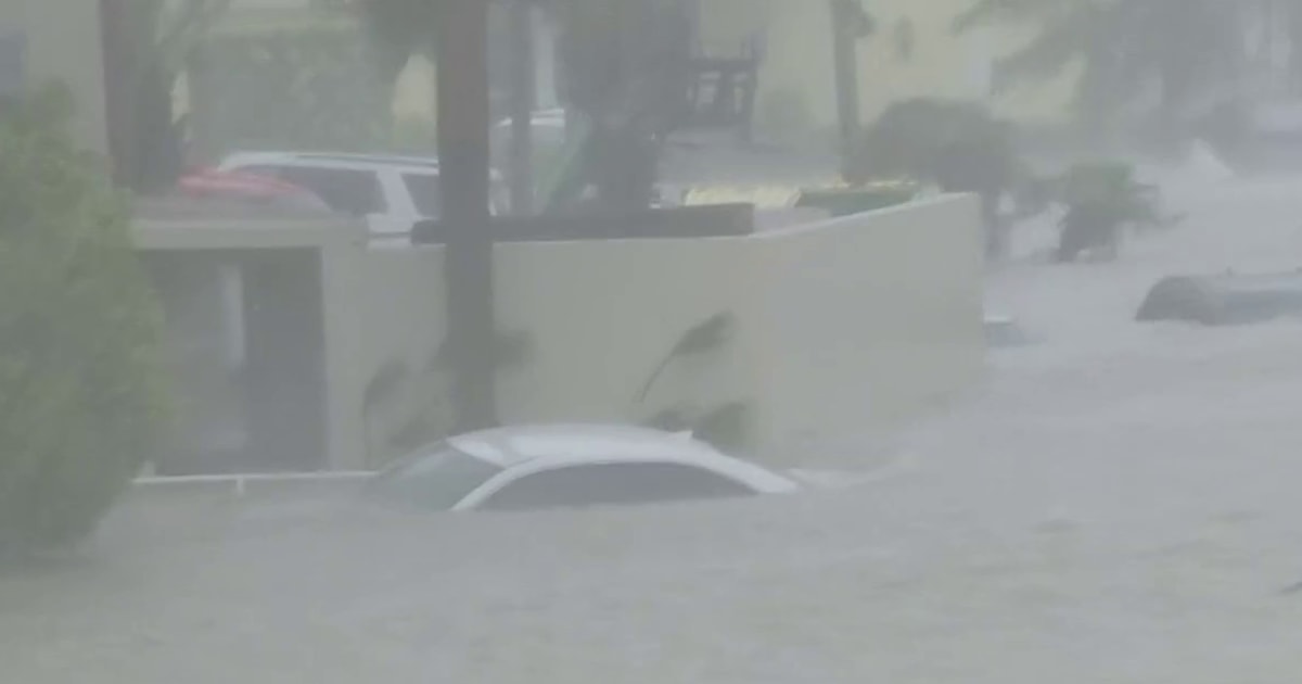 Cars submerged as Hurricane Ian brings ocean into streets