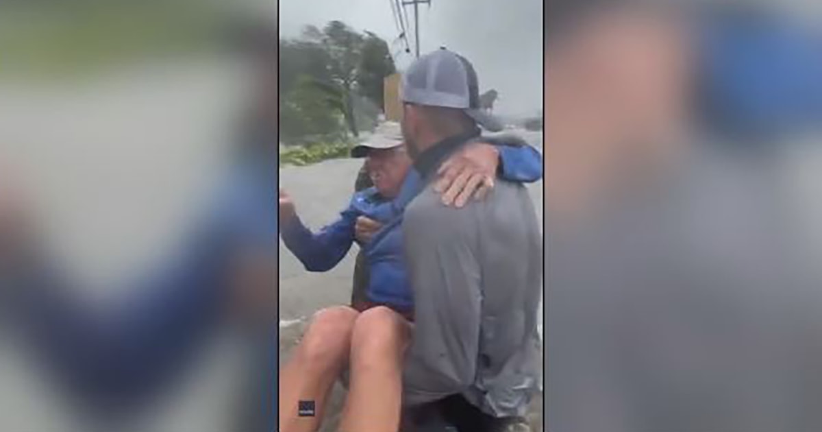 Watch: Good Samaritans rescue elderly man from flooded car during ...