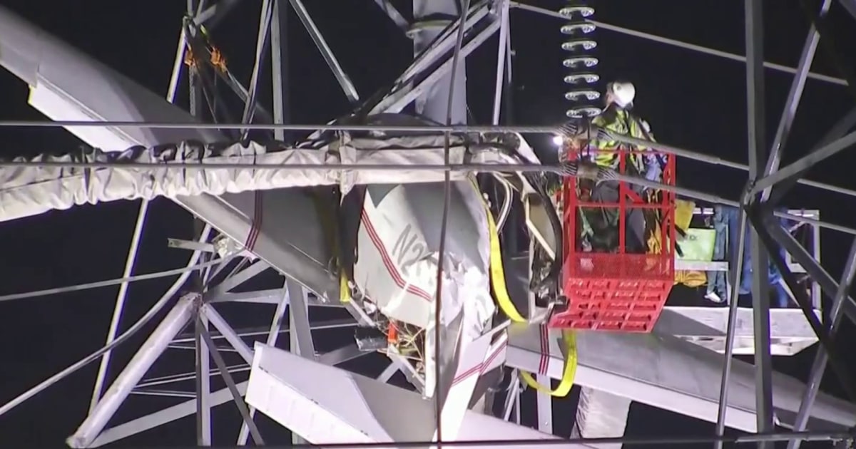 2 rescued from small plane after hitting Maryland power tower