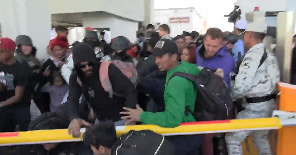 Migrants try to breach the border at El Paso, Texas