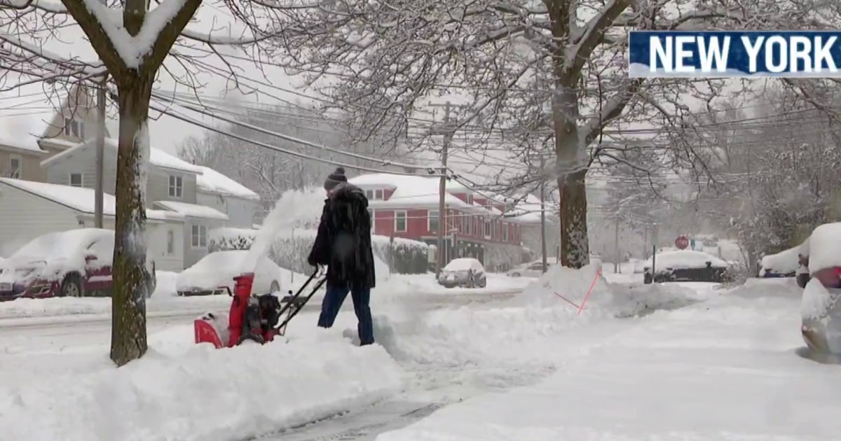 Heavy snow blankets parts of the Northeast, causing power outages and