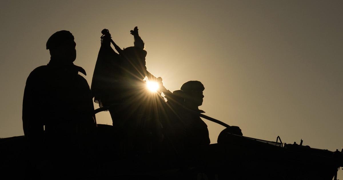 Lone piper plays at the moment British troops came ashore on D-Day 80 years ago