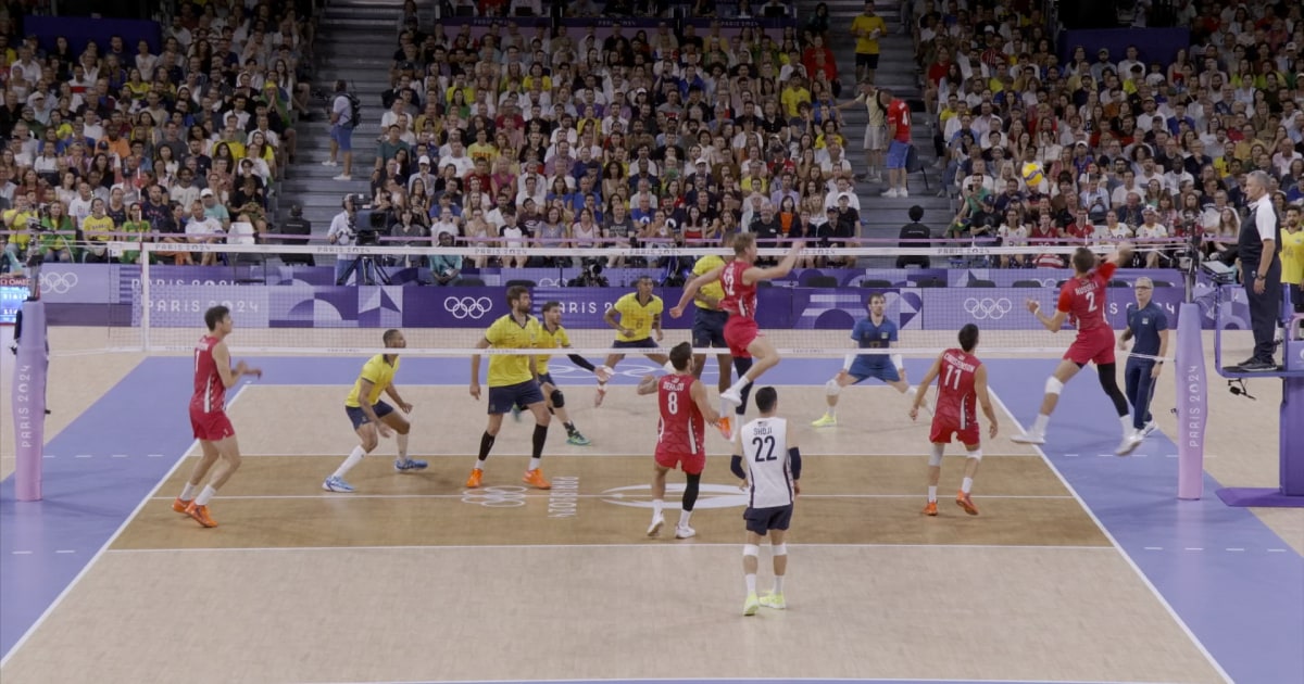 Team USA's Aaron Russell shows off his skill set with a diving dig and kill