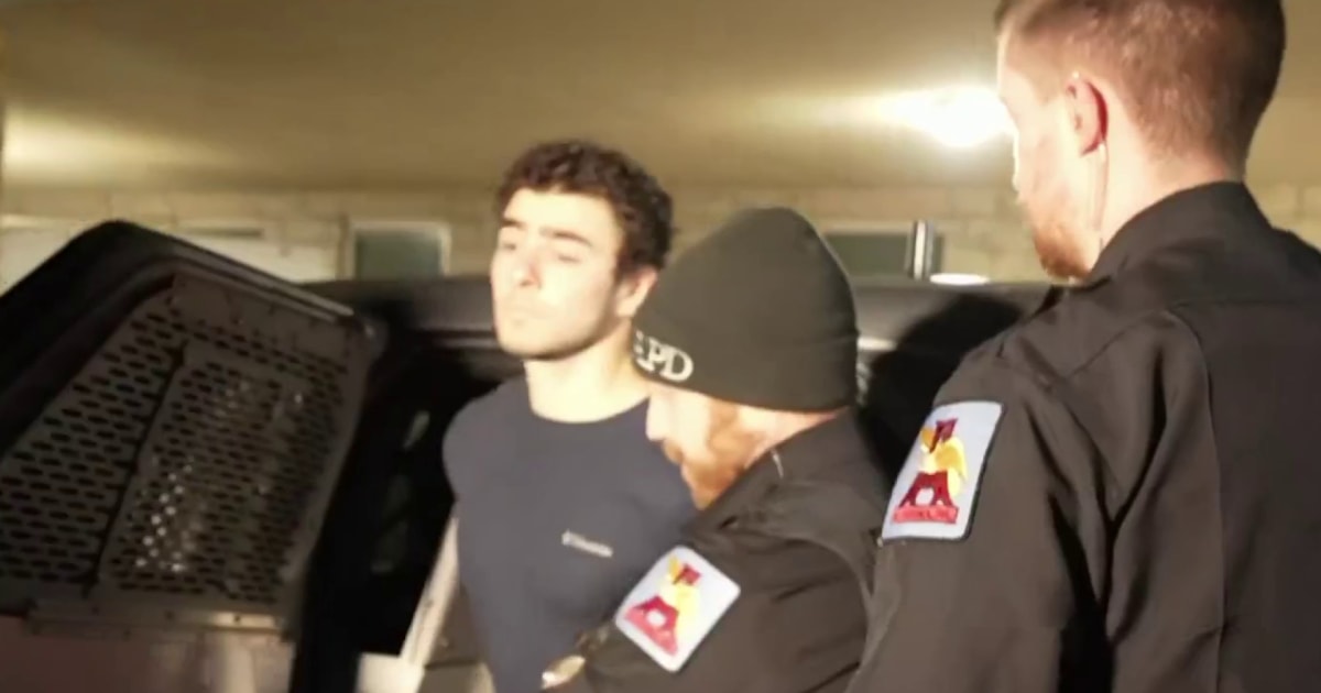 Person of interest in CEO shooting walks into courthouse for arraignment