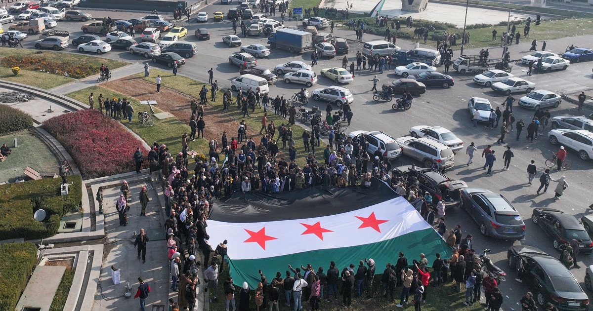 Syrians celebrate in the streets of Damascus after the fall of the Assad regime