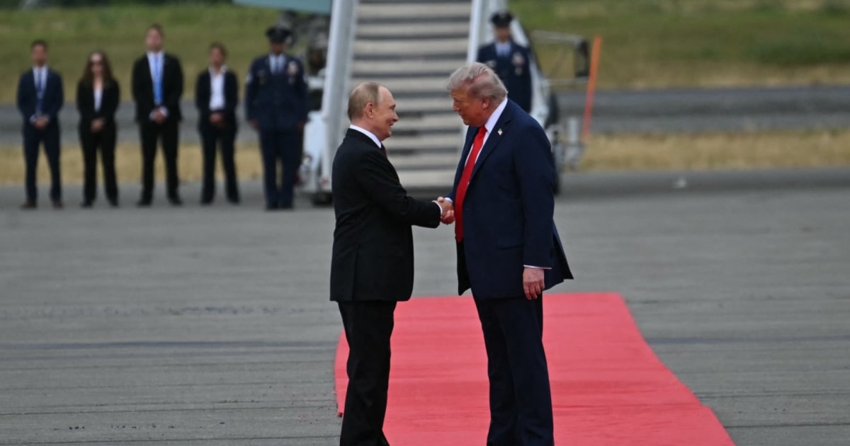 Trump and Putin arrive in Alaska, shake hands on tarmac
