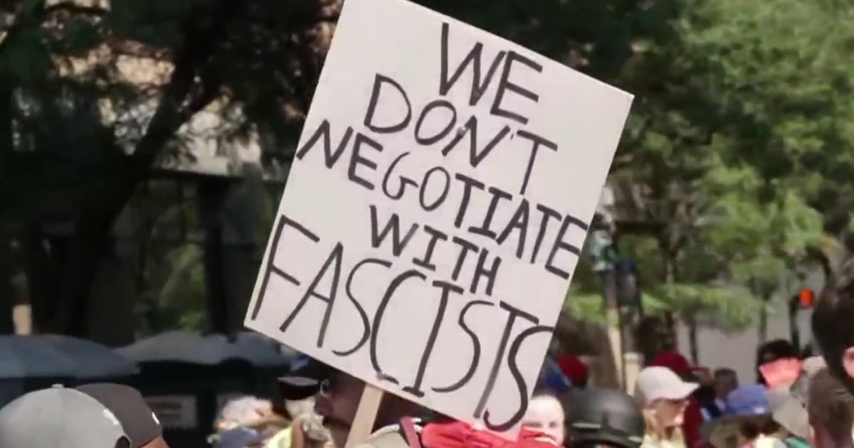 'Answer the question you coward!': Anti-Trump protests hit cities and town halls