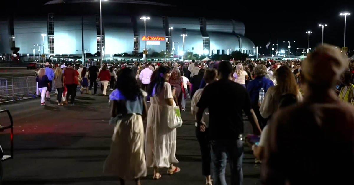 Attendees gather outside hours before Charlie Kirk’s memorial begins