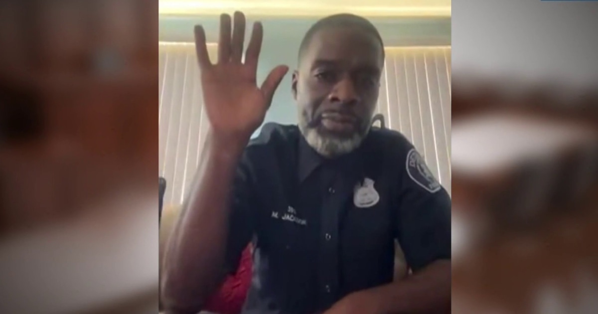 Police officer appears to be without pants in virtual court