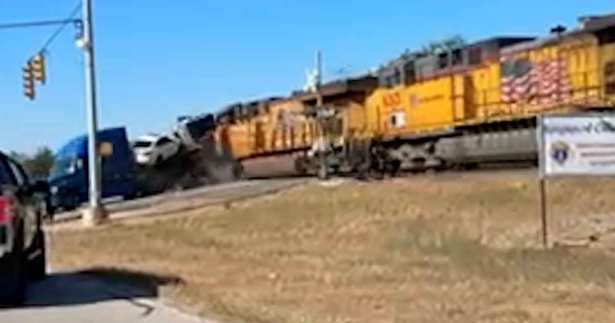 Train collides with truck hauling cars in Texas