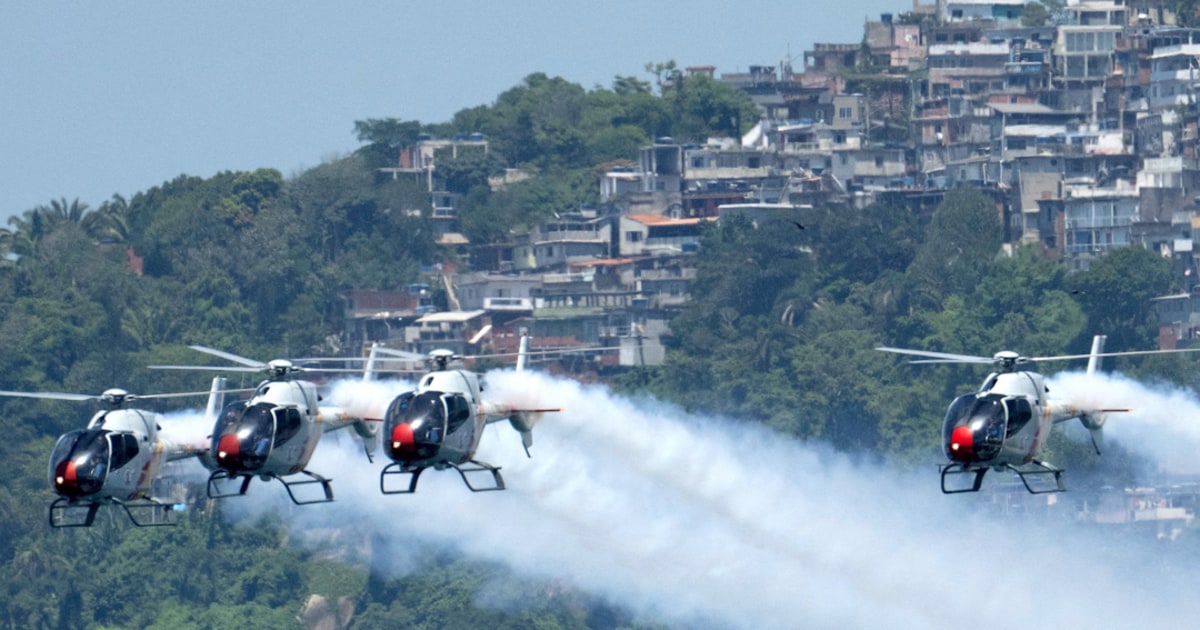 Spanish Air Power helicopter present amazes Rio beachgoers