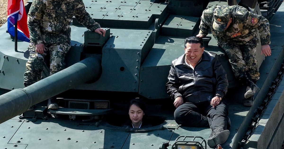 Kim Jong Un rides a tank driven by his teenage daughter
