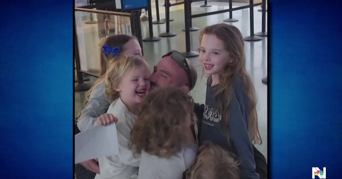Father reunites with five daughters after months overseas
