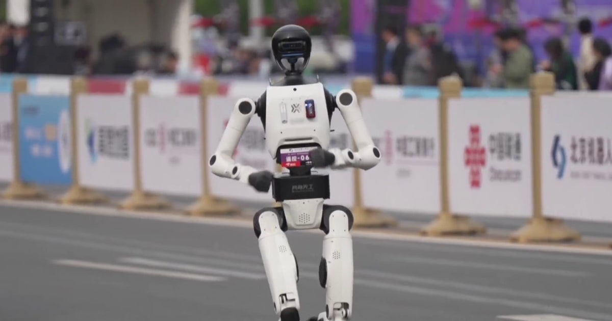 Humanoid robots race runners at Beijing half marathon
