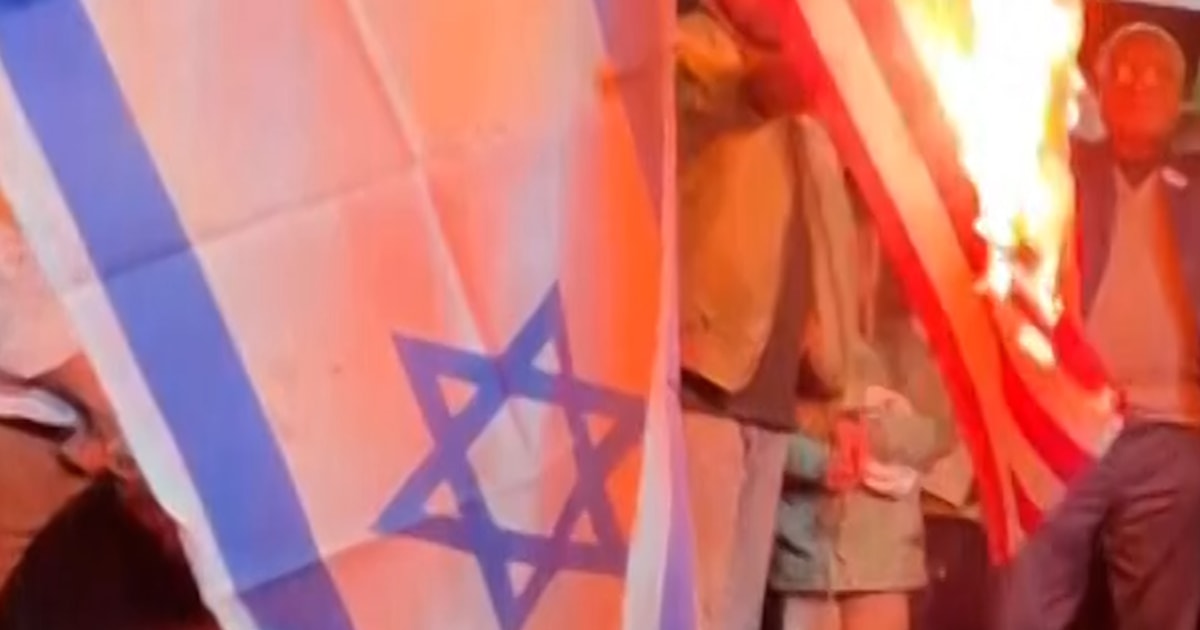 Crowds set fire to U.S. and Israeli flags in Tehran