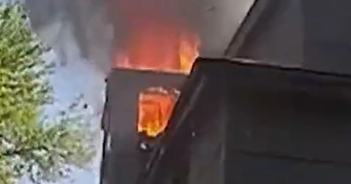 Police officer saves baby from burning house