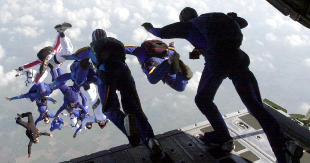 Competitors conduct a static line jump from a C-130 - PICRYL