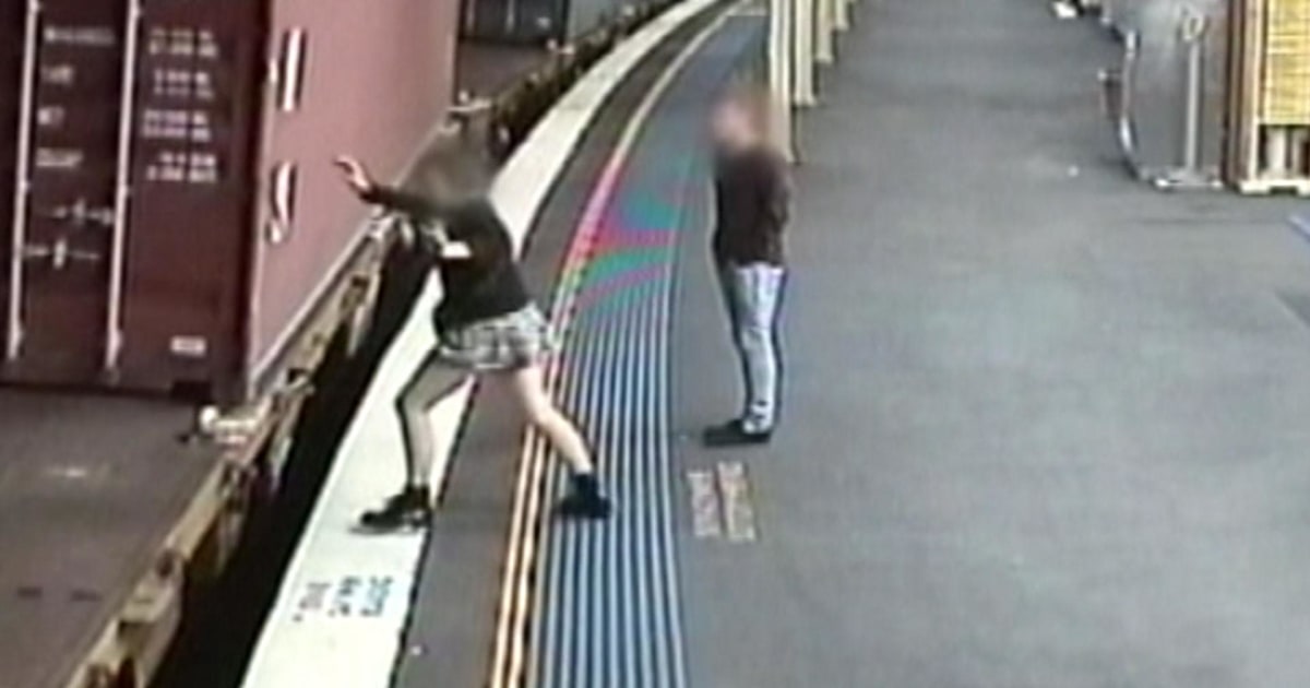 Woman Jumps onto Moving Train, Slips