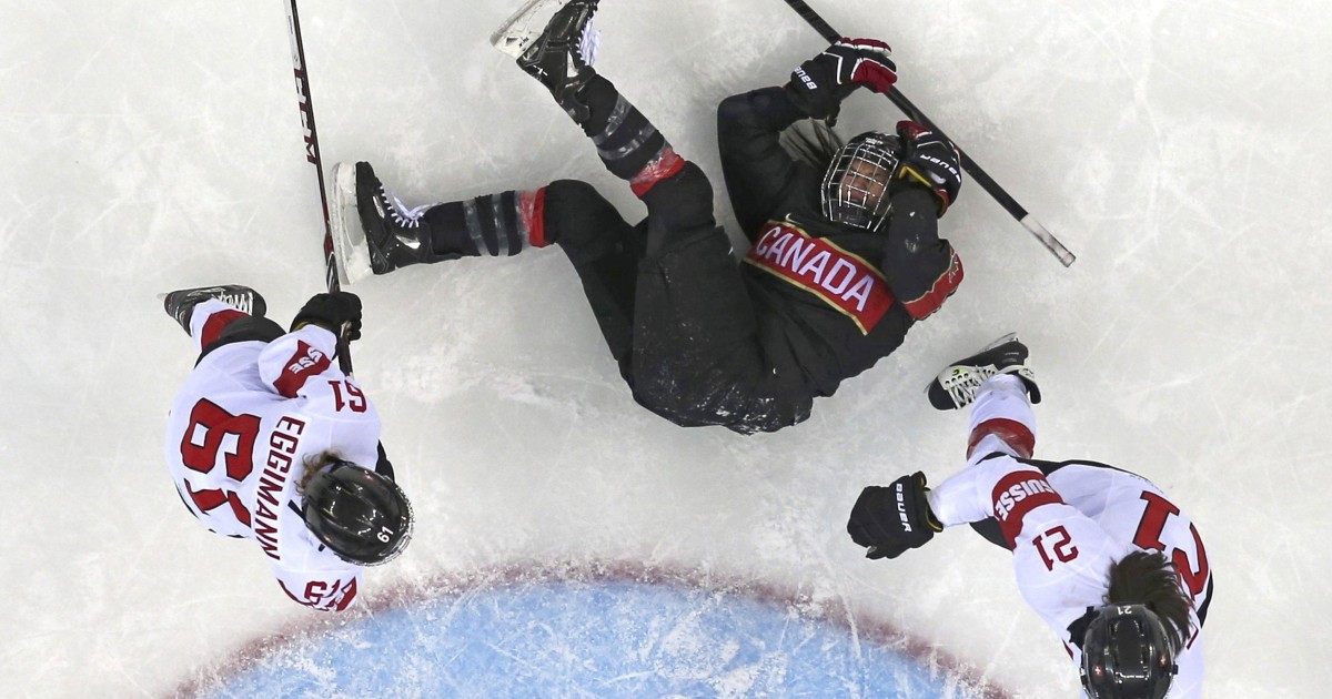 Woman Down Hockey Player Hits the Ice in Sochi