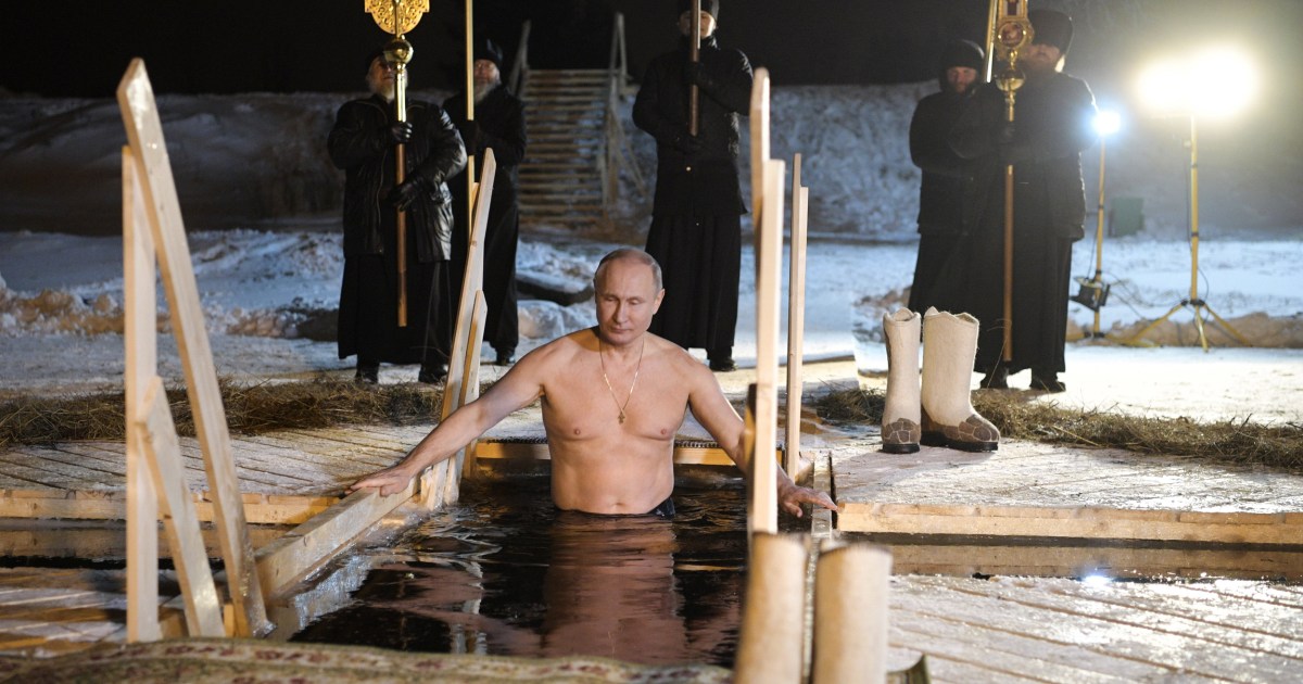 Shirtless Vladimir Putin takes dip in icy Russian lake