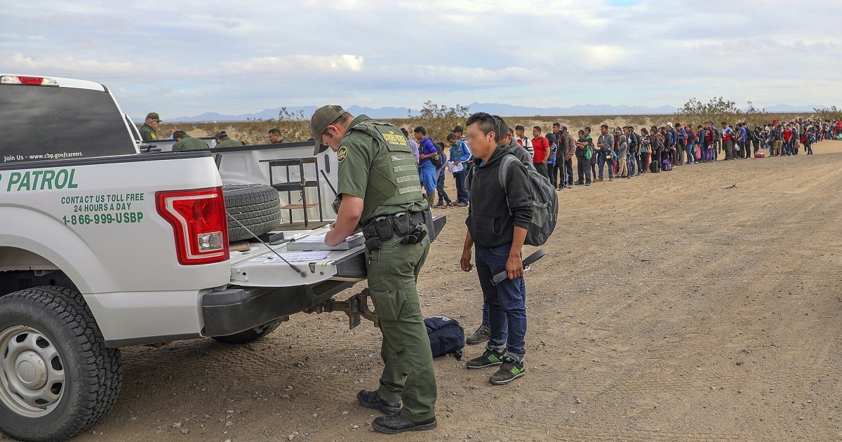 Border Patrol video shows migrants crawling under fence into U.S.