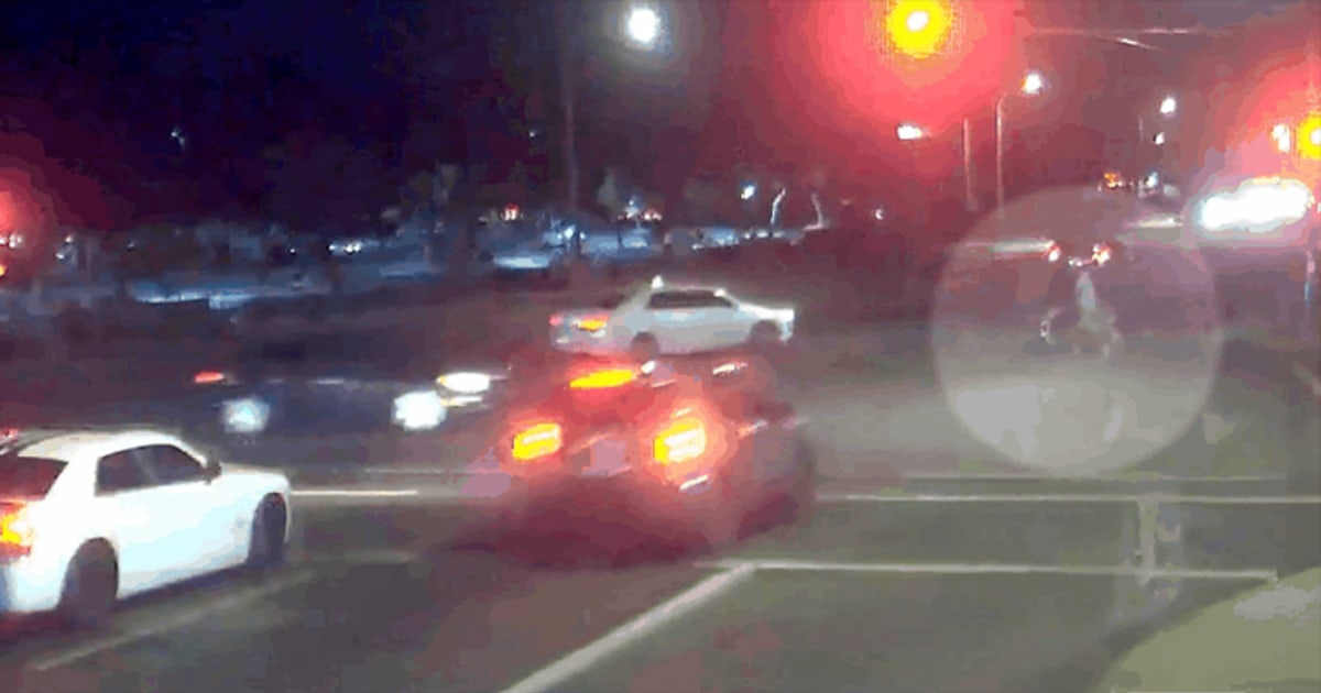 Watch as couple nearly hit by Jeep running red light is saved by another car