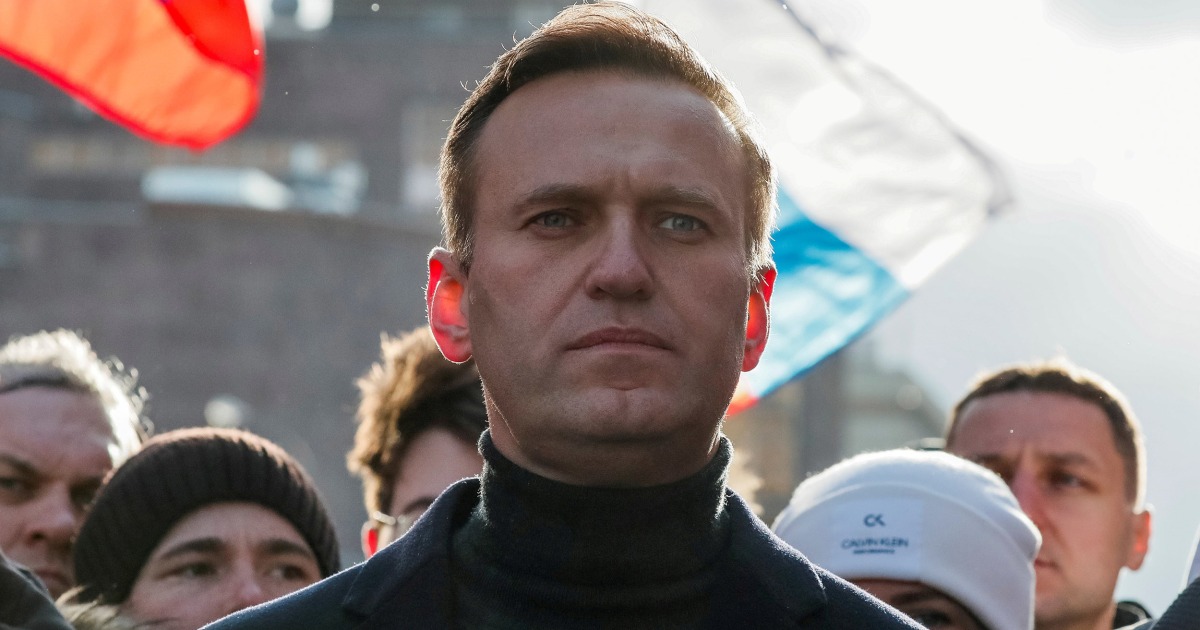Alexei Navalny buried after crowds cheer at Moscow church - cover