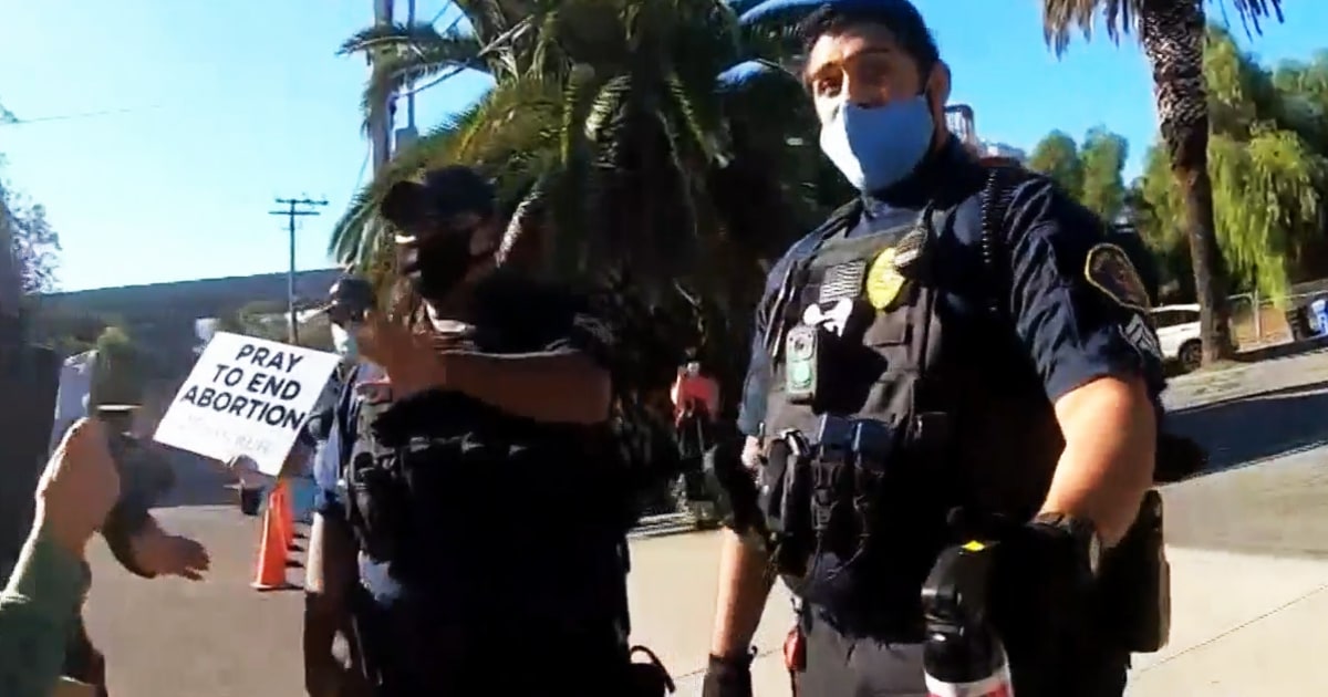 Armed anti-abortion guards pepper spray counter-protesters at ...