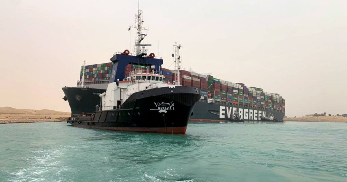 Egypt's Suez Canal blocked by stranded container ship blown sideways in