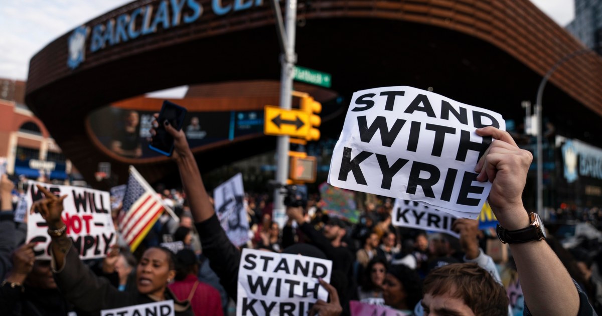 Supporters of unvaccinated NBA star Kyrie Irving storm past barricades outside game