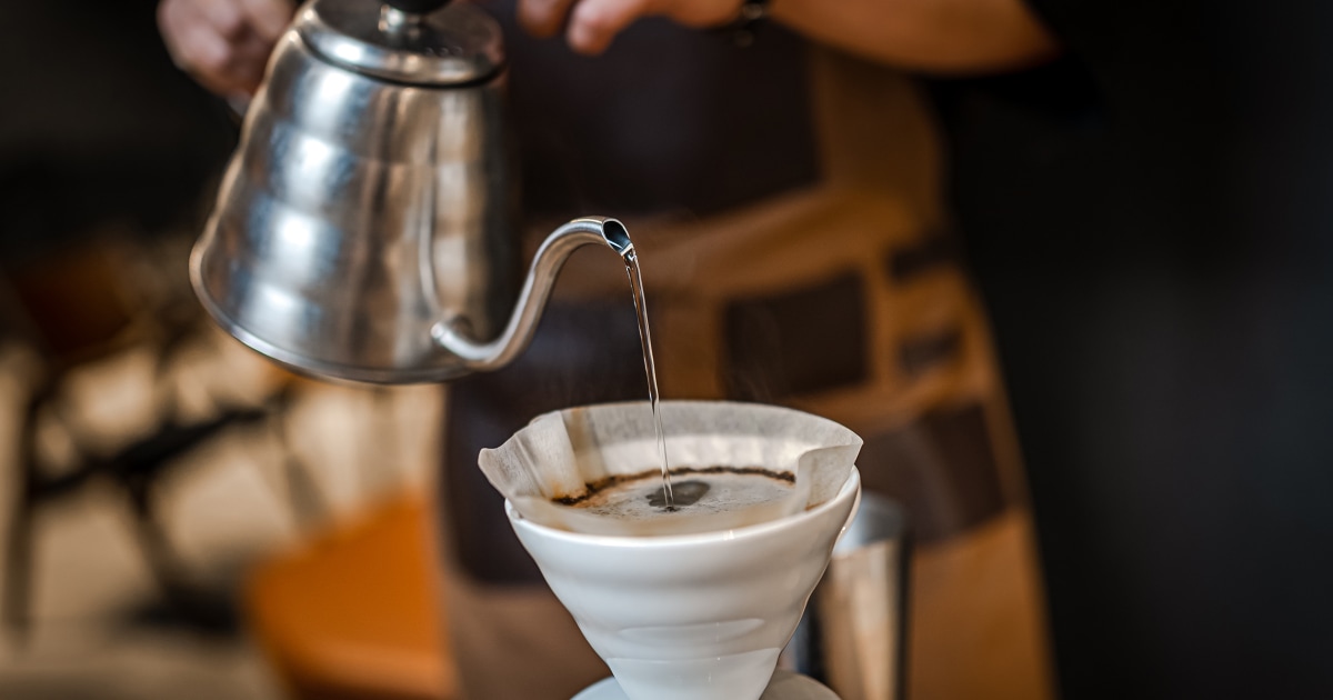 barista making pour over coffee