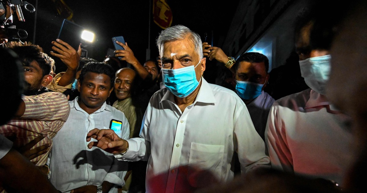 Sri Lanka reappoints five-time former PM in effort to quell political, economic crisis