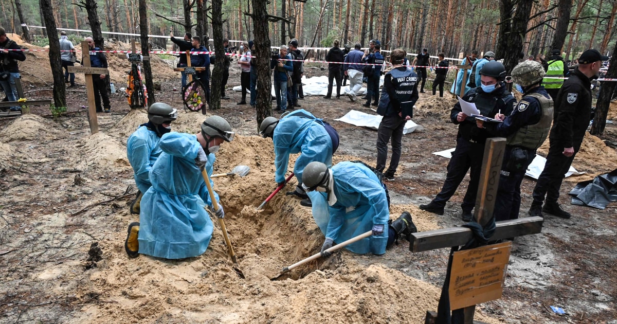 In a Ukrainian forest, Russian retreat means digging up the dead
