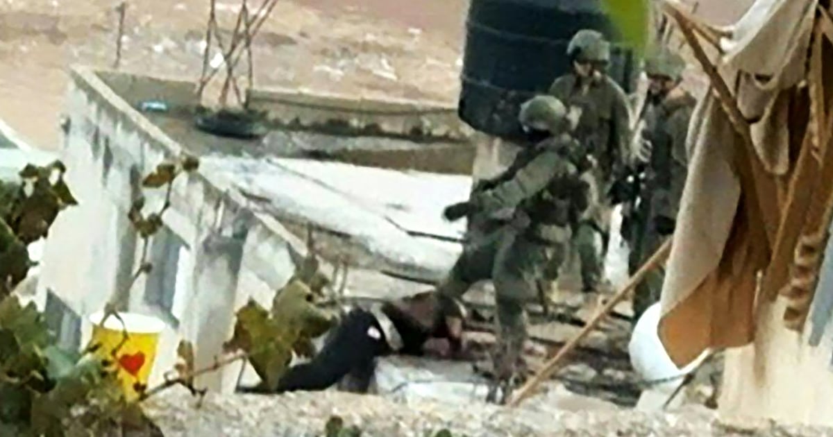 Israeli soldiers cleared bodies from a roof in the occupied West Bank.