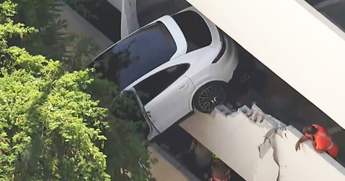 Woman rescued after crash leaves Porsche dangling from Florida ...