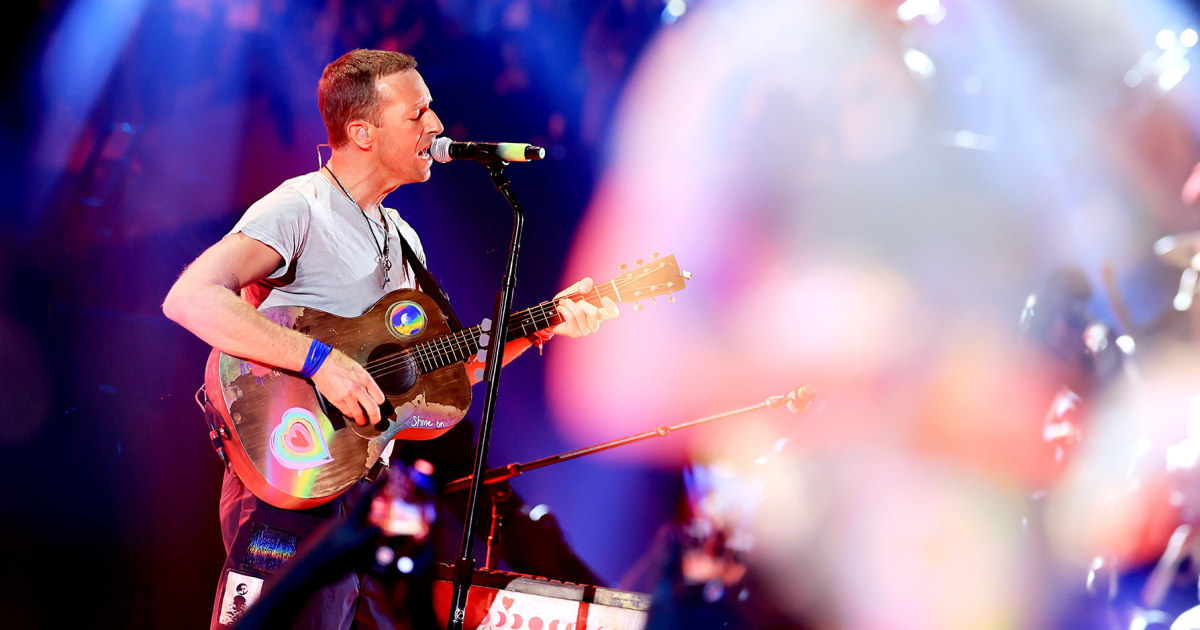 Coldplay’s Chris Martin falls through the trapdoor during a concert in Melbourne