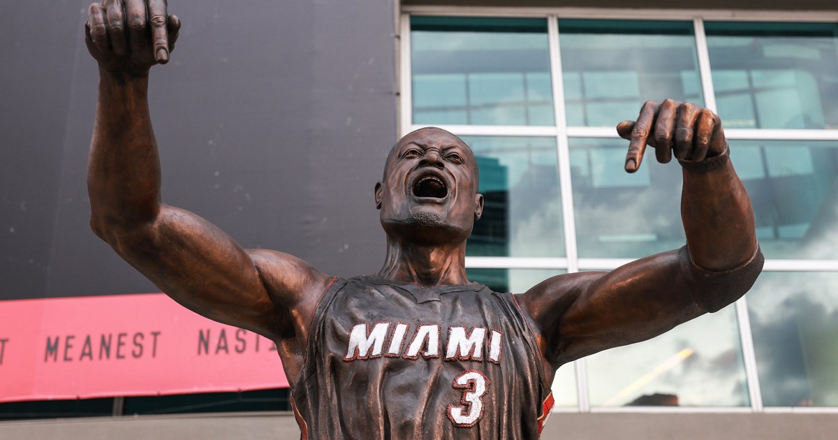 The artist behind the Dwyane Wade statue defends the Heat legend’s likeness despite criticism