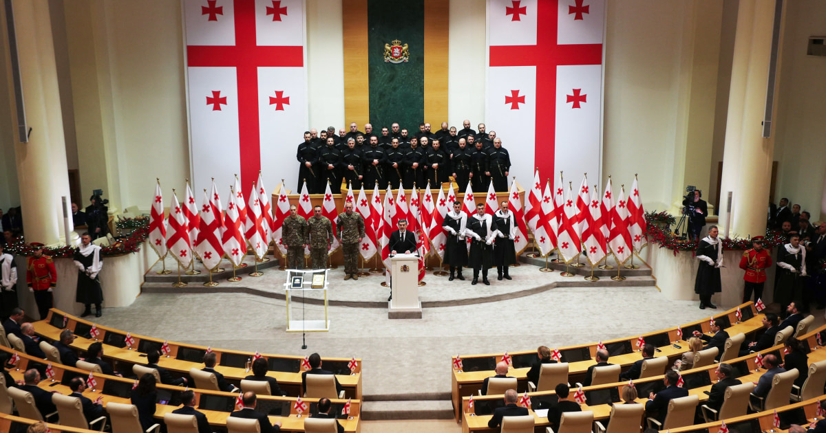 New Georgian president sworn in; predecessor says he is not legitimate leader