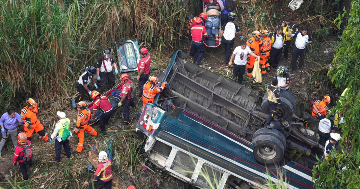 Rescue workers at an overturned bus (file photo)