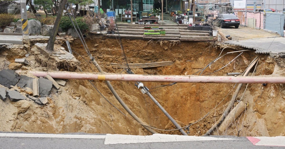 Motorcyclist dies after being swallowed by sinkhole in latest such incident