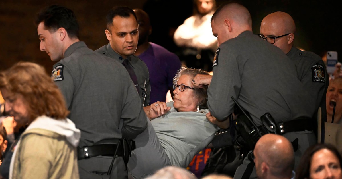 In New York, a GOP congressman is shelled with questions about Trump during raucous town hall
