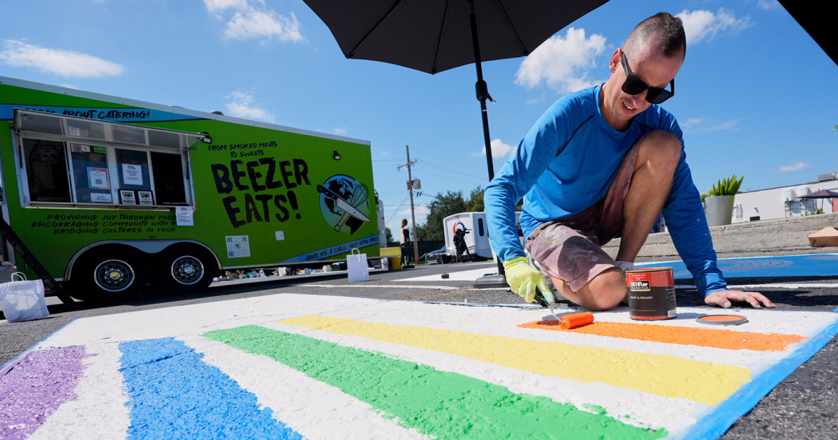 Parking spots used as colorful protest against Florida crackdown on rainbow crosswalks