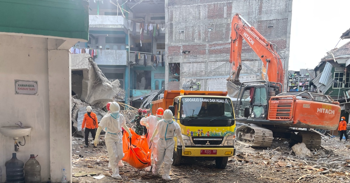 Rescuers search for missing students after Indonesian school collapse kills 49